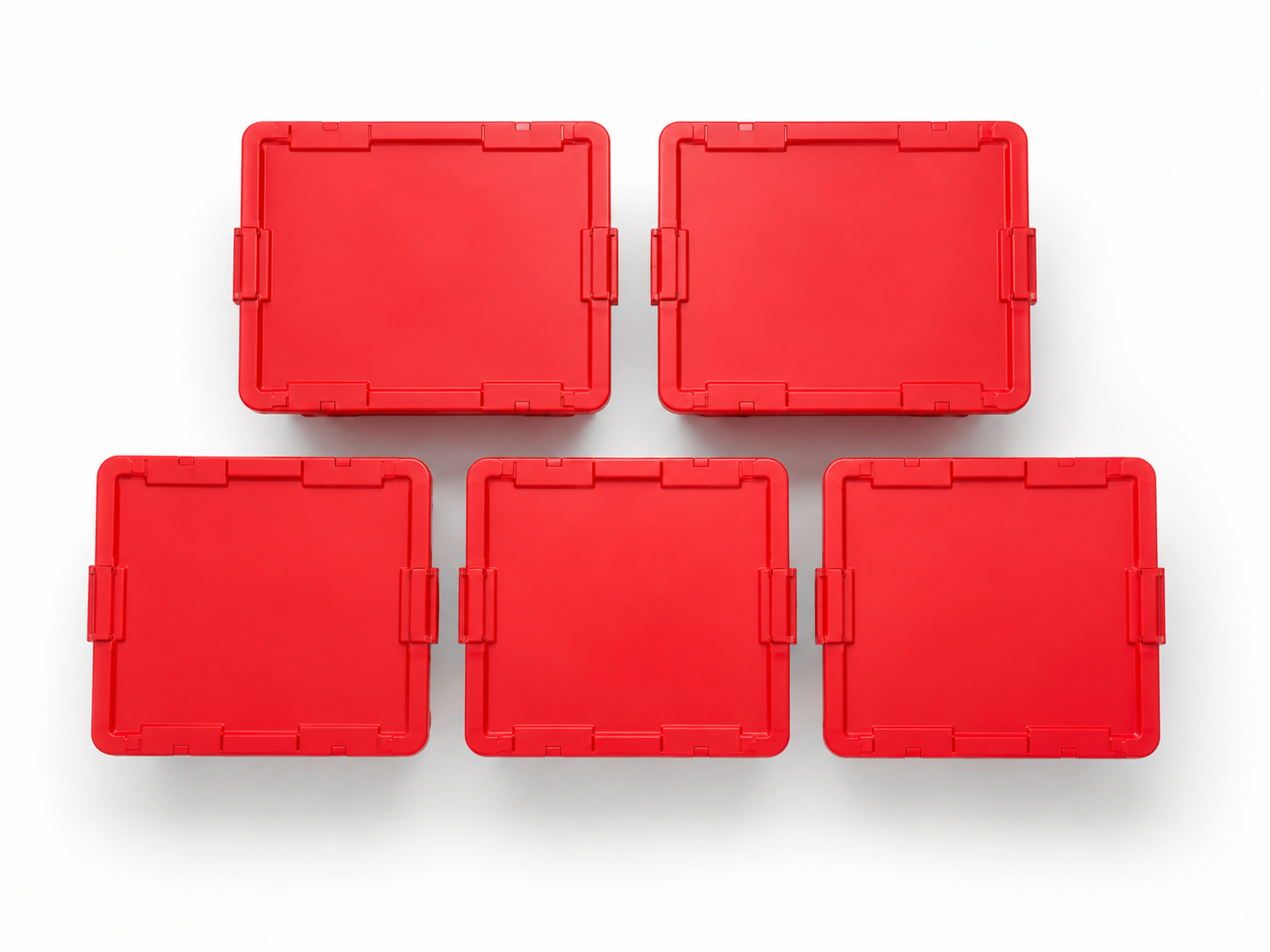 Top-down overhead view of five large clean red EazyCrate plastic moving bins with closed snap lids